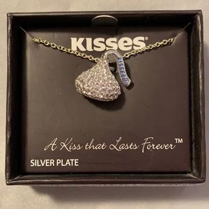 Silver plated 18” chain Hershey’s KISS necklace.  KISS has brass crystals.  New